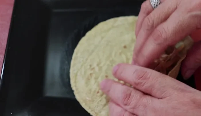 Warm the tortillas (either on a comal or in a microwave).