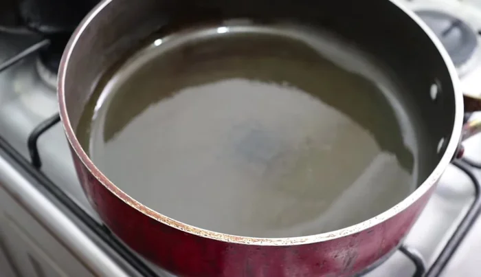Heat oil in a thick frying pan for 5 minutes. Add the rice and fry until it turns a light creamy color, stirring frequently to prevent sticking. A thick pan is crucial to prevent burning. If using a thin pan, use a comalito underneath.