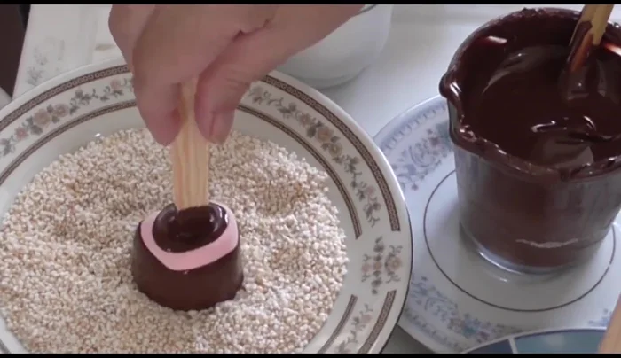 Roll the chocolate-covered candies in amaranth or chopped walnuts.