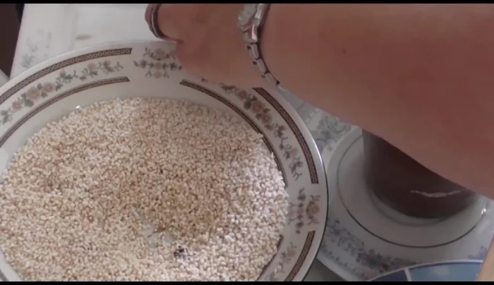 Place the coated candies in a small cup to hold them while the chocolate sets, then refrigerate for quick cooling.