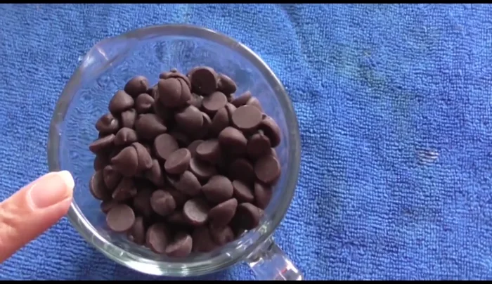 Melt the chocolate in a microwave or double boiler. Add vegetable shortening or butter if needed to help it melt smoothly.