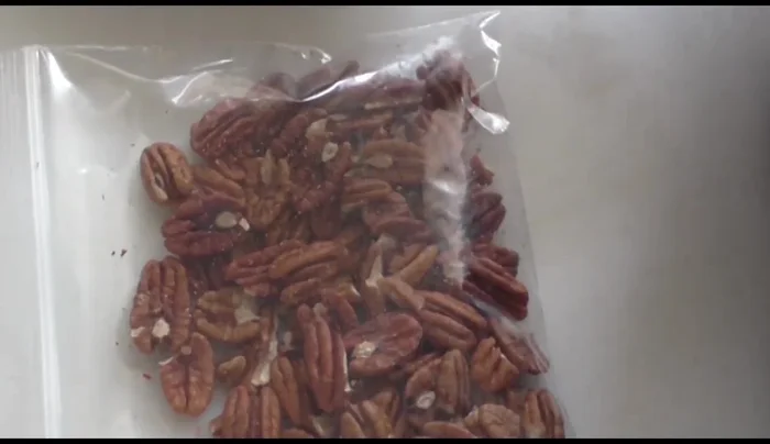 Chop or crush the walnuts using a molcajete or food processor.
