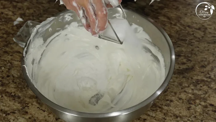Add the shortening and salt to the creamed lard, mixing thoroughly until the salt dissolves.