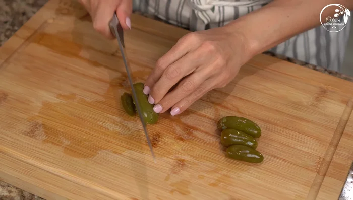 Dice the pickled jalapeño peppers.
