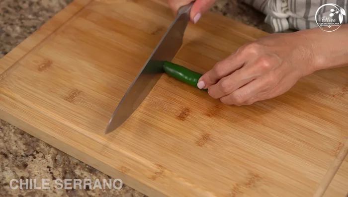Slice the serrano pepper (remove seeds for less heat).