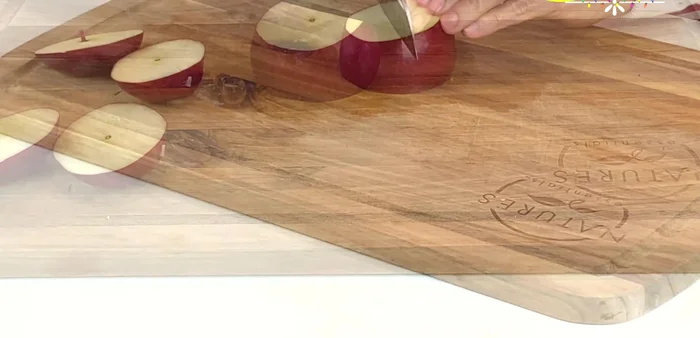 Finely chop the red apple into cubes. (111.62)