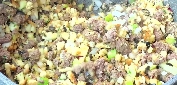 Add the toasted bread cubes and mix until all ingredients are well combined. (259.17)