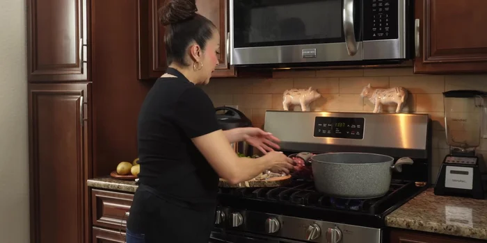In a deep pot on medium-high heat, add the beef, water (to cover), cilantro paste, chopped onion, garlic, and salt. Simmer for approximately 2 hours.