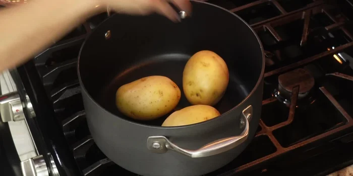 While the beef simmers, cook the potatoes in a separate pot on medium heat for about 40 minutes, ensuring they're covered with water.