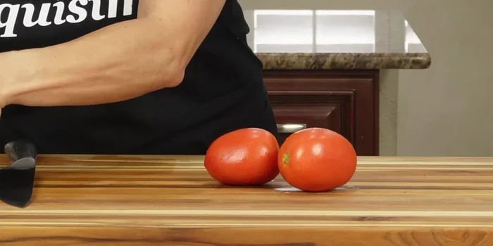Prepare the sauce: Cut the Roma tomatoes into squares. In a molcajete (or food processor/blender), grind the chile de árbol with salt until a paste forms. Combine with the chopped tomatoes.
