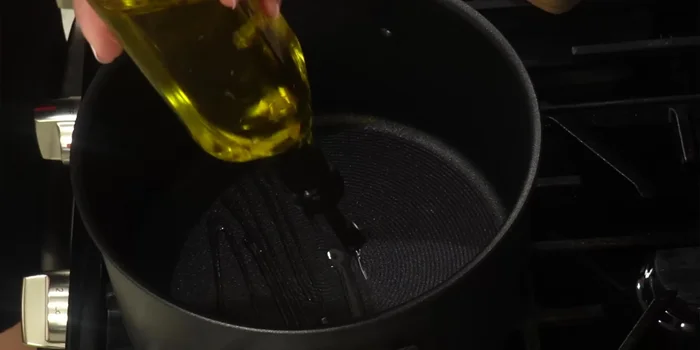 Heat olive oil in a pan over medium heat.