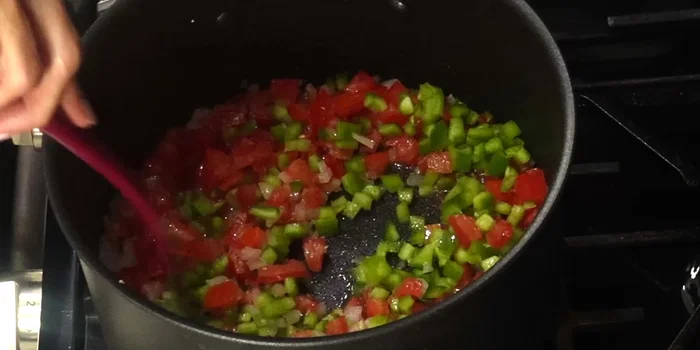 Add the chopped Anaheim chiles and cook until fragrant and incorporated.