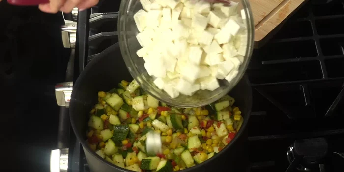 Stir in the cheeses until melted and combined with the other ingredients. Cook for another 2-4 minutes.