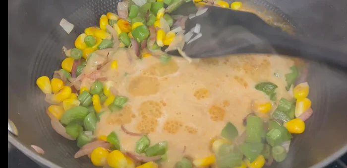 Add the vegetable puree to the pan with the vegetables. Stir and cook slightly. Add basic spices (salt, vegetable masala or coriander powder). Cook well, stirring continuously, until spices are cooked.