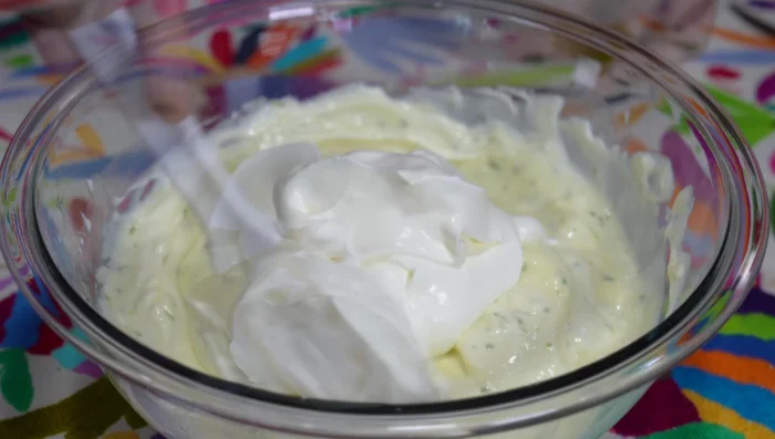 Fold in the remaining whipped cream. Add green food coloring if desired.