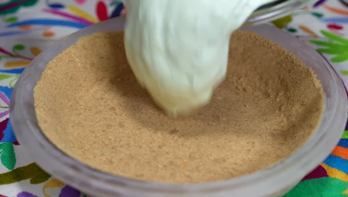 Pour the filling into the frozen pie crust and distribute evenly. Freeze until completely solid.