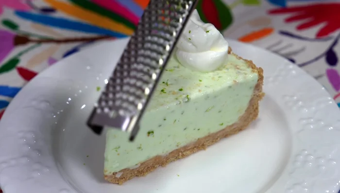 Once frozen, decorate with whipped cream, lemon zest, and thin lemon slices.
