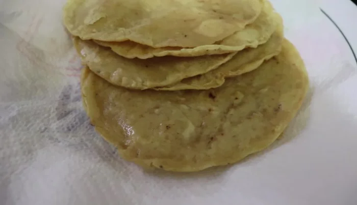 Place the fried tortillas on absorbent paper.
