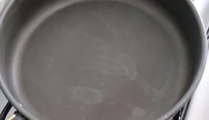 In a frying pan, sauté the chopped onion until transparent.