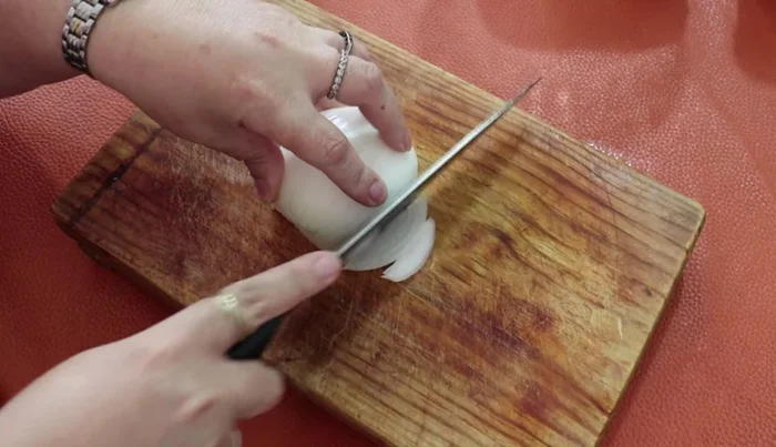 Finely chop half an onion.