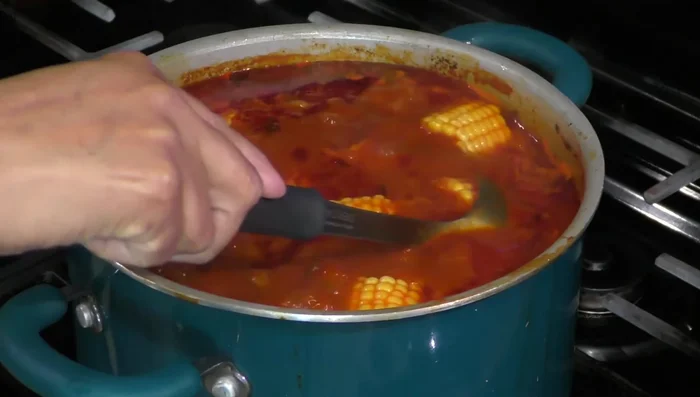 Add the remaining vegetables (zucchini, potato, cabbage) and the corn dough balls to the pot. Cook for 5-15 minutes.