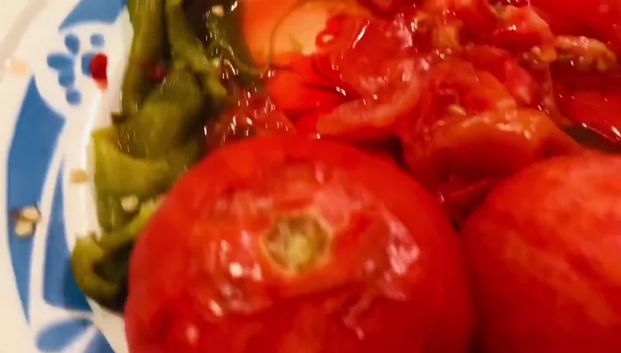 Combine the peeled and seeded chilies, tomatoes, and garlic in a blender or food processor. Add salt to taste and a little water or chicken broth to help blend.