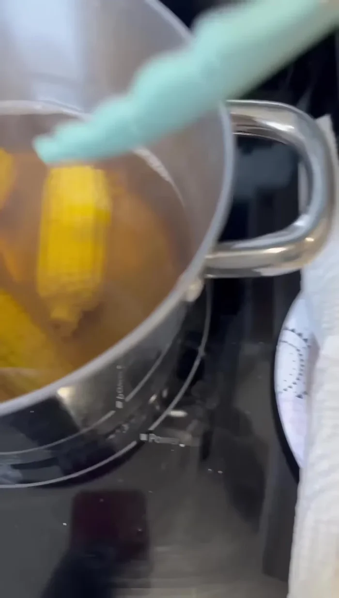 Once the corn is cooked, remove it from the water and place it on a paper towel.