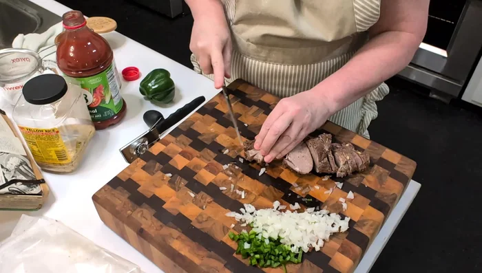 Chop the leftover cooked beef.