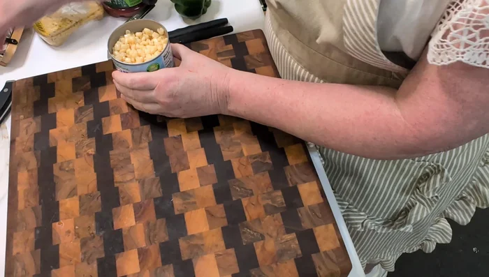 Drain the canned corn.