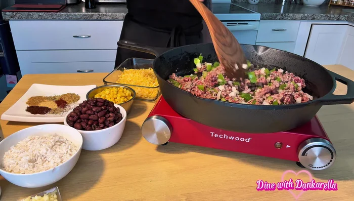 If using ground chuck, remove excess grease before adding onions and peppers.