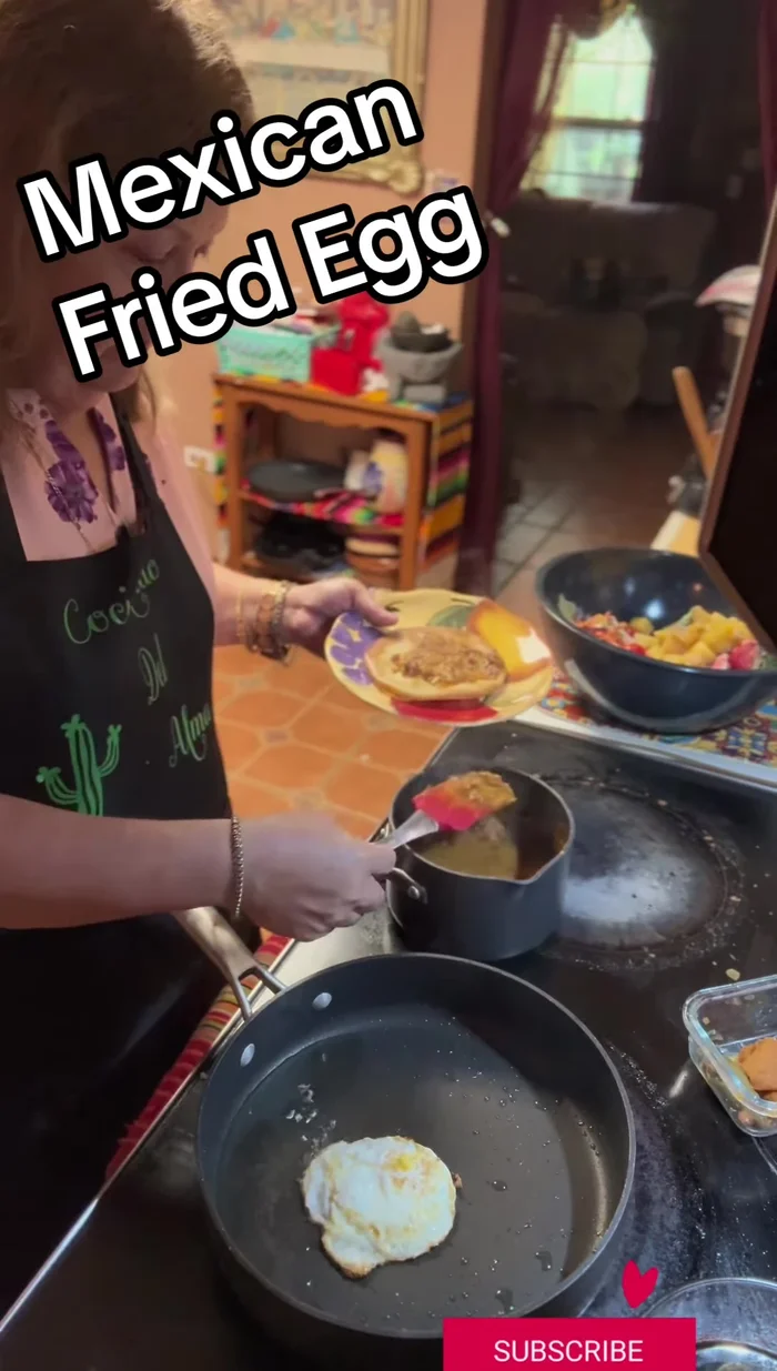 Assemble the tostada: Spread refried beans on the tostada. Top with the fried egg.