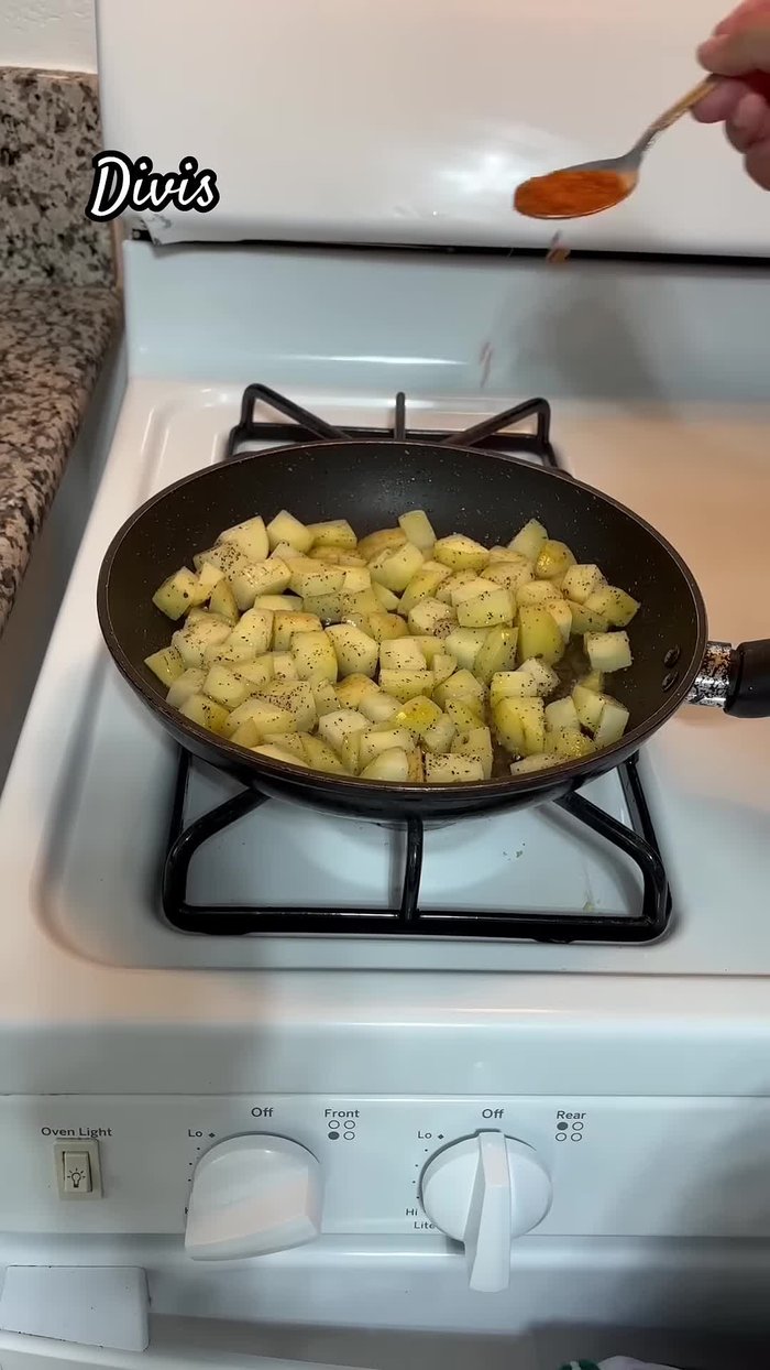 Add pepper, garlic salt, and chicken-flavored seasoning (tomato based) to the potatoes.