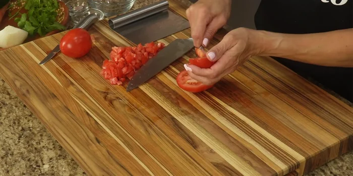 Dice the tomatoes, removing seeds and pulp.