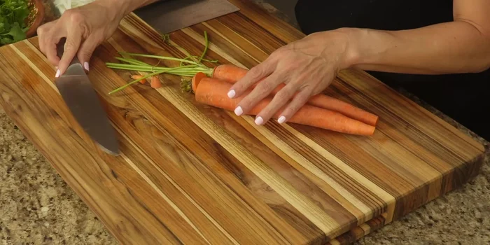 Peel and dice the carrots into small cubes.