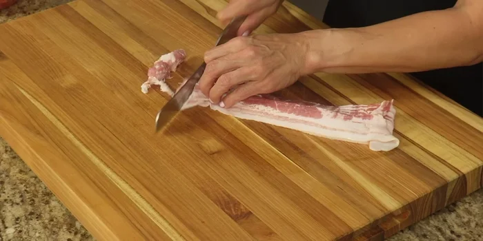 Dice the bacon into small squares.