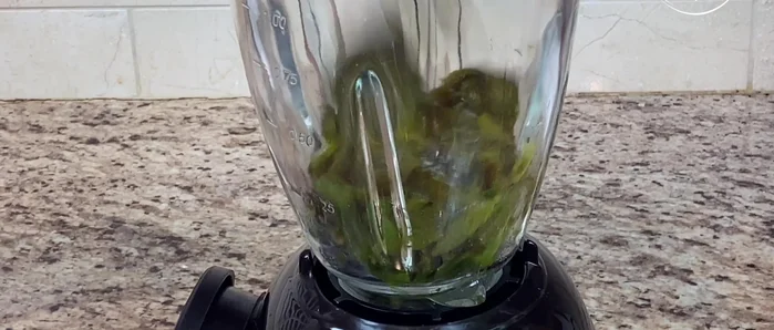 Quarter the onion and use only one quarter. Blend the chopped chiles, cilantro, onion, garlic, Mexican cream, milk, seasoning powder, and salt in a blender until smooth. Set aside.