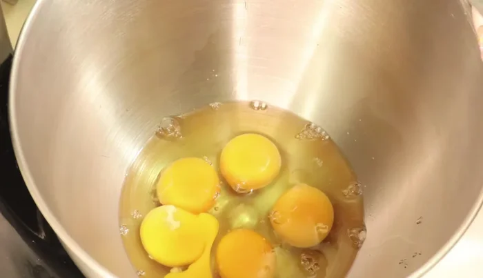 Cream the butter and sugar: In a mixer, beat 5 eggs (room temperature) with half the sugar. Gradually add the remaining sugar while beating until fluffy (about 5 minutes).