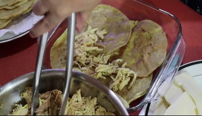Add a layer of shredded chicken.