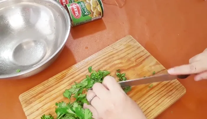 Add chopped parsley and continue frying.