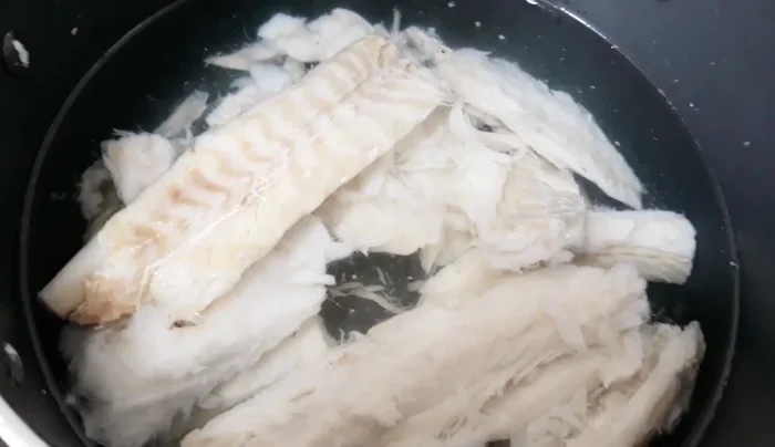 Boil the cod in plain water until fully cooked.