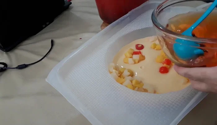 Add final layer and freeze: Add the remaining fruit and top with the peach gelatin mixture. Freeze until completely set. (393.38)