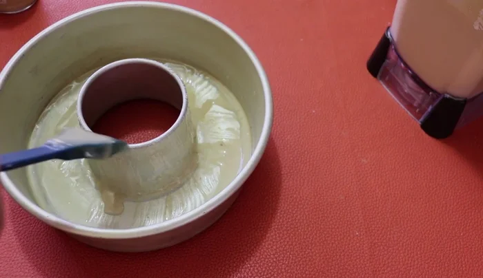 Grease and flour the cake mold using the release agent.
