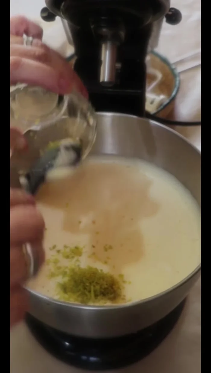 Add orange zest (without white pith), condensed milk, orange juice, and vanilla extract to the beaten eggs. (145.8)