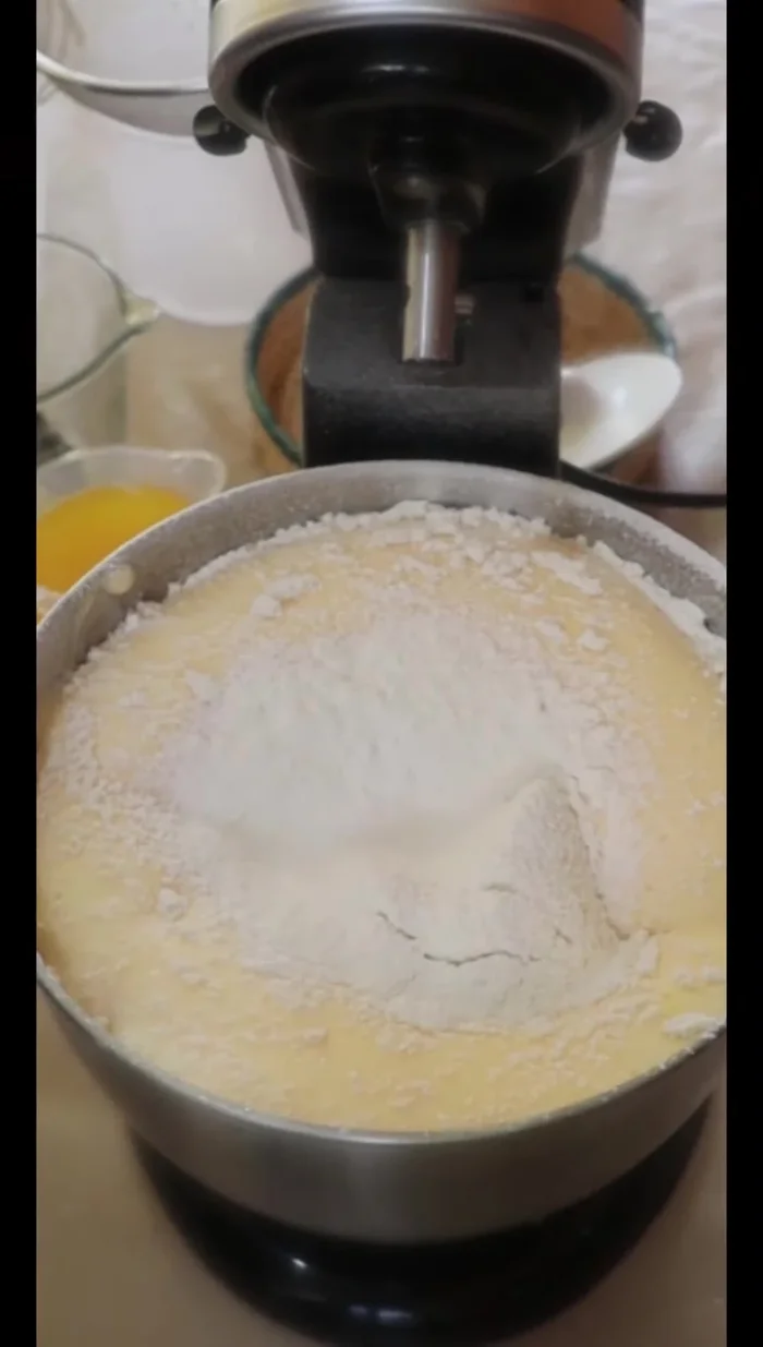Sift together flour and baking powder, then gradually add to the wet ingredients, mixing until just combined. (182.959)