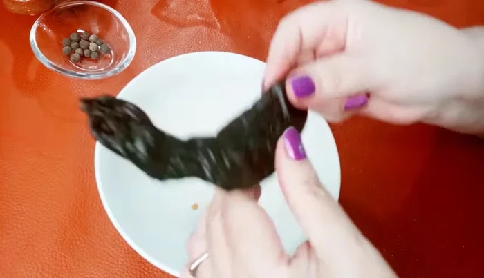 Remove the stems from the pasilla chiles using scissors. Open the chiles and remove all seeds and veins (optional).