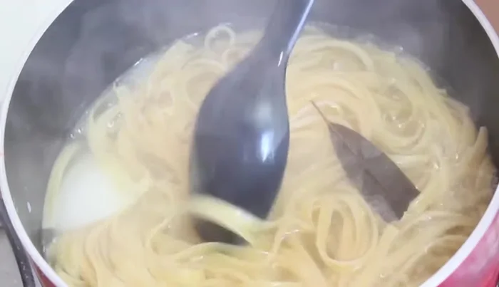 Drain the cooked pasta and set aside.