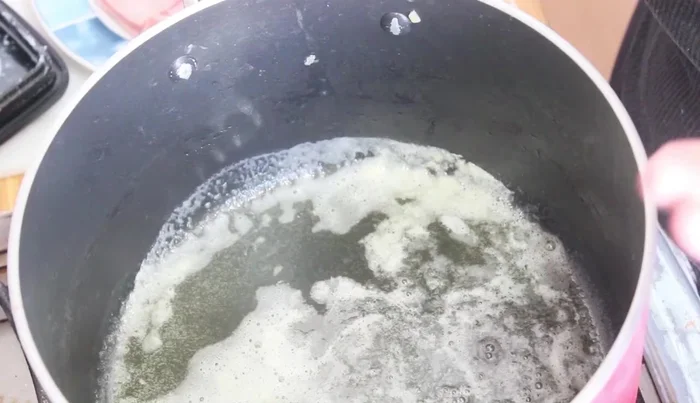 Add the blended white sauce mixture to the melted butter and stir until it boils and thickens.