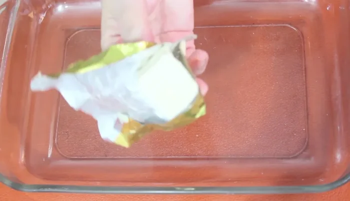 Transfer the pasta mixture to a buttered casserole dish.