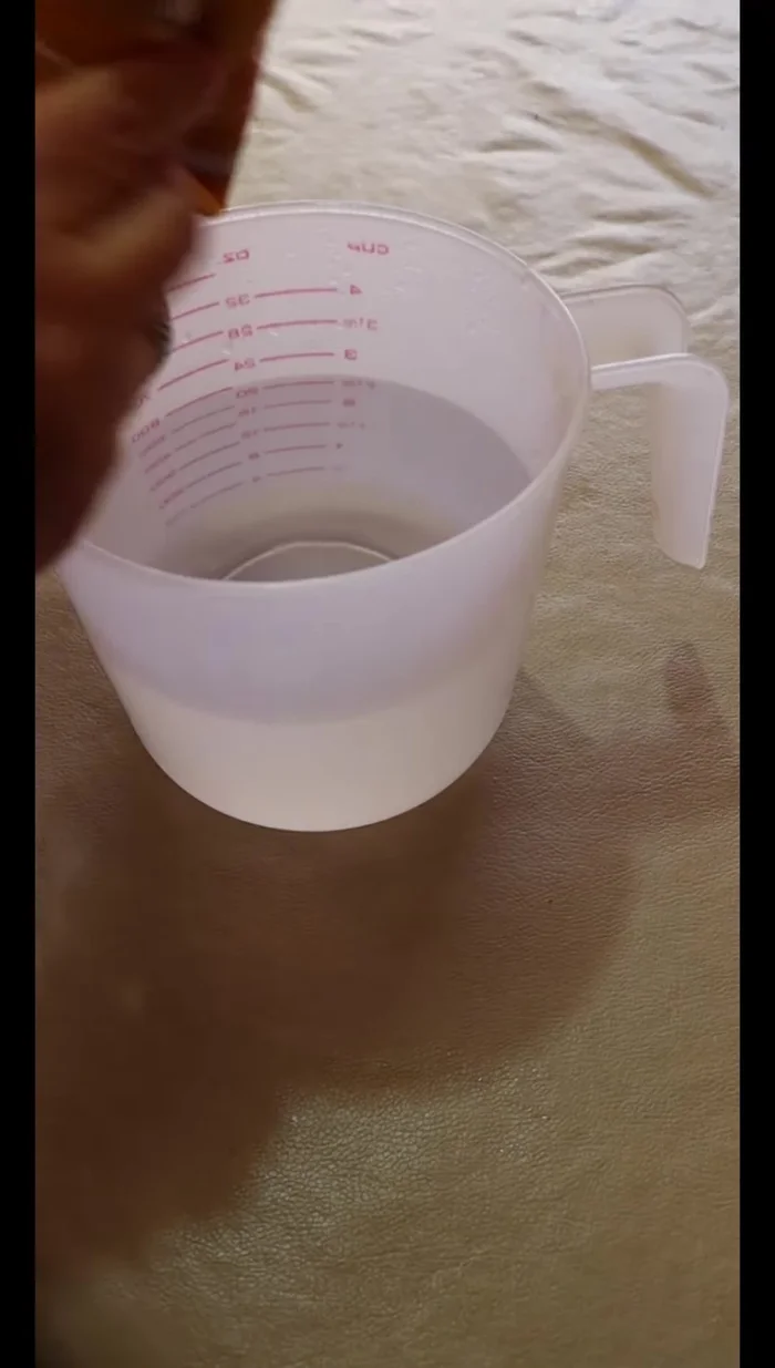 Prepare the gelatin: Dissolve two 120g packages of pineapple gelatin in six cups of boiling water until smooth.