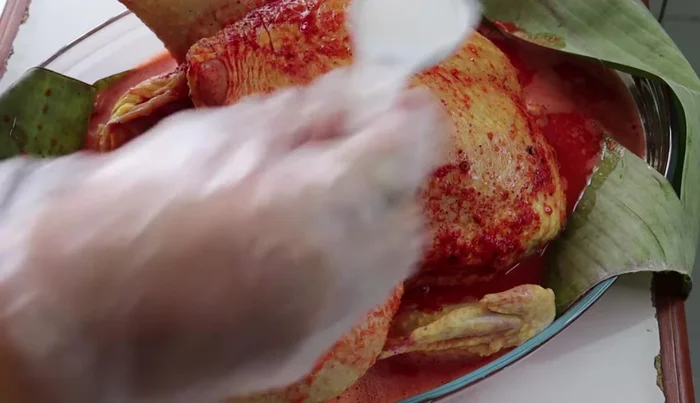 Add salt (2 tablespoons) to the chicken. (Note: Salt was already added earlier)